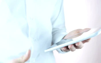 Stock Video Man Holding A Tablet Makes A Thumb Up Sign Animated Wallpaper