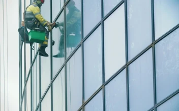 Stock Video Man Hanging On Ropes Cleaning Windows In A Building Animated Wallpaper