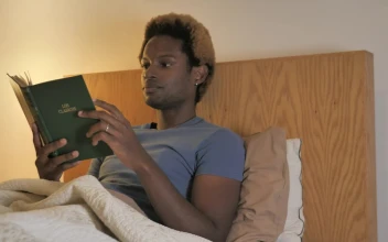 Stock Video Man Goes To Sleep After Reading Animated Wallpaper