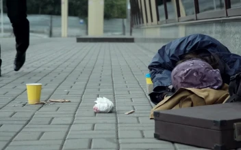 Stock Video Man Giving Money To Homeless Resting On The Street Animated Wallpaper
