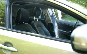 Stock Video Man Getting Into A Car And Putting On A Seat Animated Wallpaper