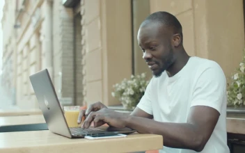 Stock Video Man Gets Emotional While Chatting Online Outside Ith Laptop Animated Wallpaper