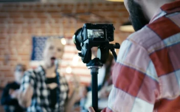 Stock Video Man Filming A Musical Band Animated Wallpaper