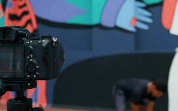 Stock Video Man Exercising While Videotaping Animated Wallpaper