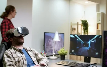 Stock Video Man Enjoys Virtual Gaming In Home Office Animated Wallpaper