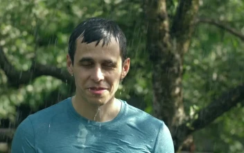 Stock Video Man Enjoying The Rain In Nature Animated Wallpaper