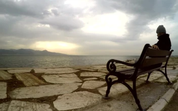 Stock Video Man Enjoying The Peace Of Seeing The Sea Animated Wallpaper