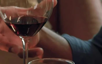 Stock Video Man Drinking Wine From A Glass At A Romantic Dinner Animated Wallpaper