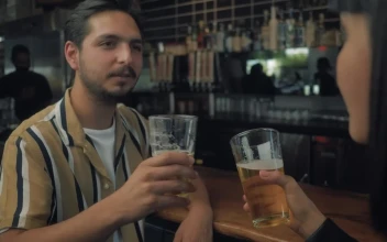Stock Video Man Drinking Beer With His Date Animated Wallpaper