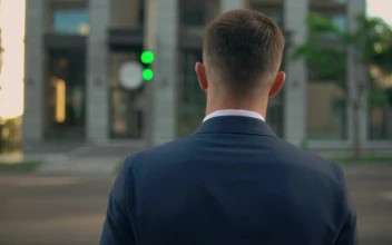 Stock Video Man Dressed In Suit Crossing The Street Animated Wallpaper