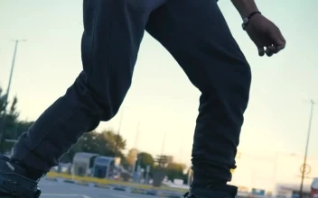 Stock Video Man Doing Tricks With Roller Skates In A Parking Lot Animated Wallpaper