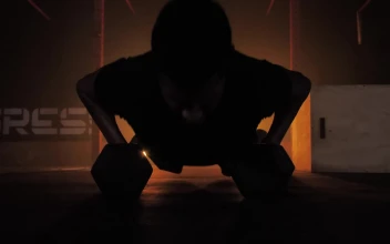 Stock Video Man Doing Push Ups Using Dumbbells Animated Wallpaper