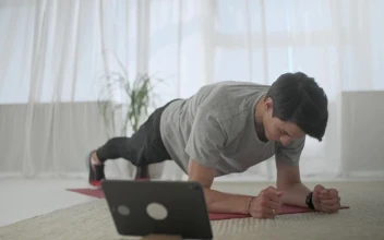 Stock Video Man Doing Plank Exercise In His Living Room Animated Wallpaper