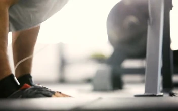 Stock Video Man Does Weight Loss Workout Pushups With Earbuds Animated Wallpaper