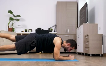 Stock Video Man Does Full Body Yoga Exercise In Living Room Animated Wallpaper