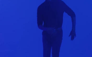 Stock Video Man Dancing Under Changing Lights Animated Wallpaper