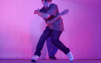 Stock Video Man Dancing Break Dance With A Girl Behind Animated Wallpaper