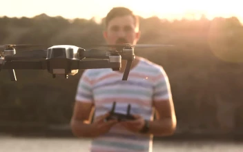 Stock Video Man Controlling Drone With With Remote Controller Animated Wallpaper