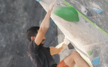Stock Video Man Climbing Up A Sloping Mountaineering Wall Animated Wallpaper