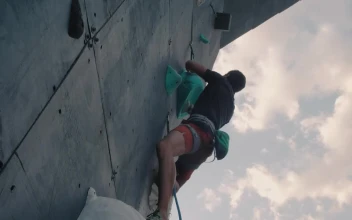 Stock Video Man Climbing To The Top Of A Mountaineering Wall Animated Wallpaper