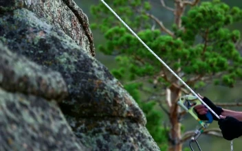 Stock Video Man Climbing A Rock Animated Wallpaper