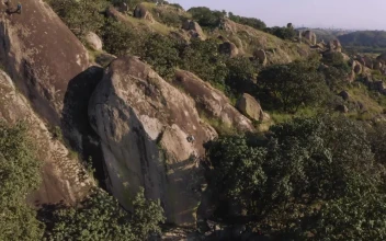 Stock Video Man Climbing A Mountain Seen From Above Animated Wallpaper