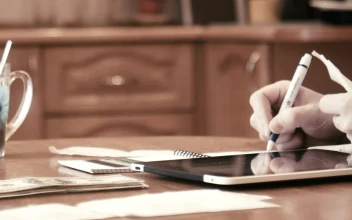 Stock Video Man Checking Bills And Doing Budgets Animated Wallpaper