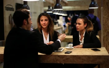 Stock Video Man Chatting With Two Women In A Cafe Animated Wallpaper