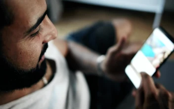 Stock Video Man Browsing Social Media On Smartphone Top View Animated Wallpaper