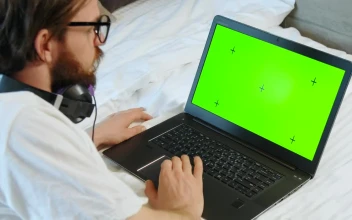 Stock Video Man Browses Greenscreen Website On Laptop In Bed Animated Wallpaper