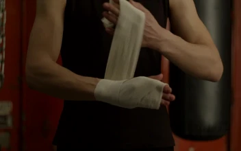 Stock Video Man Bandaging His Hand Before Boxing Animated Wallpaper
