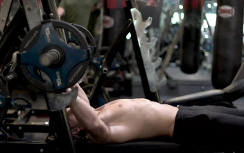Stock Video Man At The Gym Exercising With A Dumbbell Animated Wallpaper
