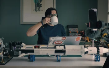 Stock Video Man At His Laptop In His Study With Many Objects Animated Wallpaper