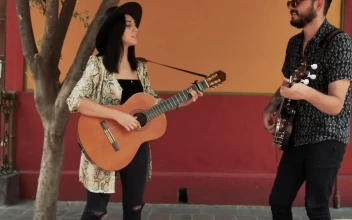 Stock Video Man And Woman Playing Music On The Street Asking For Animated Wallpaper