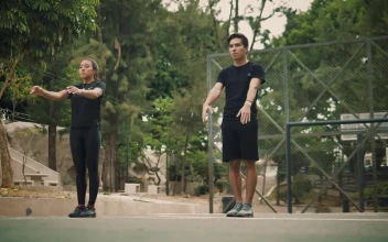 Stock Video Man And Woman Doing A Back Turn In Unison Animated Wallpaper
