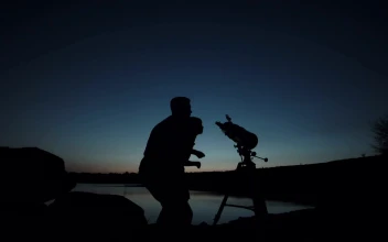 Stock Video Man And A Boy You Using The Telescope At Dusk Animated Wallpaper