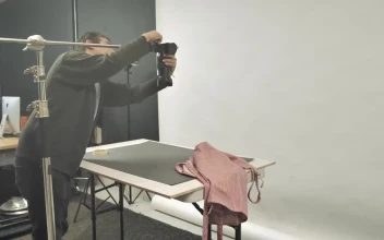 Stock Video Man Adjusting A Camera In The Studio Animated Wallpaper