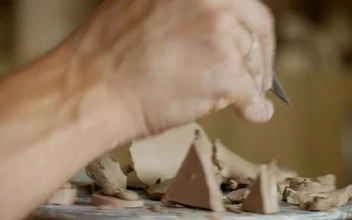 Stock Video Male Working On Clay With Cutting Tools Animated Wallpaper
