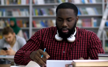 Stock Video Male Student Reading In The Library Animated Wallpaper
