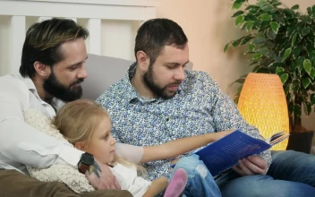 Stock Video Male Couple Reading A Story To A Child Animated Wallpaper