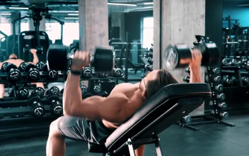 Stock Video Male Bodybuilder Doing Chest Exercises With Dumbbells Animated Wallpaper