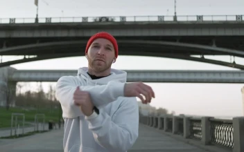 Stock Video Male Athlete Stretching His Arms Before Training Animated Wallpaper