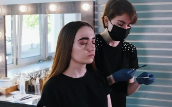 Stock Video Makeup Artist With Medical Mask Working On A Womans Eyebrows Animated Wallpaper