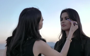 Stock Video Makeup Artist Putting Makeup On A Model Animated Wallpaper
