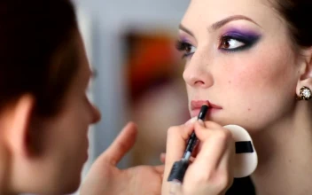 Stock Video Makeup Artist Doing Lips On A Model Animated Wallpaper