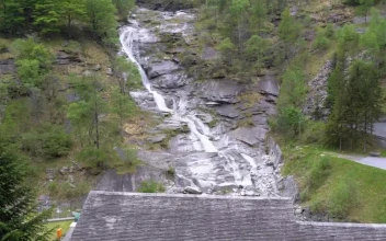 Stock Video Low View Of A Waterfall On A Forested Mountain Animated Wallpaper