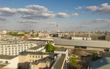 Stock Video Low Flight Over The Rooftops Of Berlins Buildings Animated Wallpaper