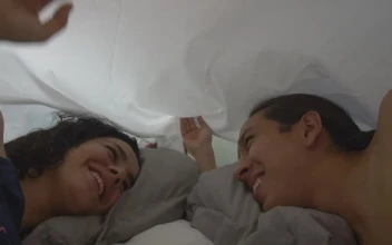 Stock Video Loving Couple Looking At Each Other Appreciatively In Bed Animated Wallpaper