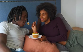 Stock Video Lovers Lying On A Bed Eating A Dessert Animated Wallpaper