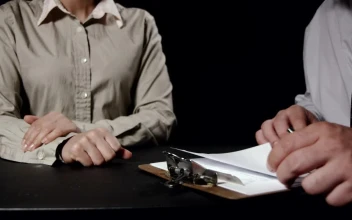 Stock Video Looking At Reports On A Clipboard Animated Wallpaper